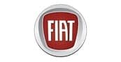 The image shows the Fiat logo, featuring the word FIAT in bold white letters on a red background, enclosed within a silver circular border.