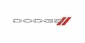The image shows the Dodge logo with the word DODGE in silver capital letters, followed by two red diagonal stripes to the right.