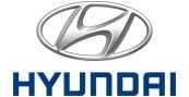 The Hyundai logo featuring a silver stylized H inside an oval, with the brand name HYUNDAI written in bold blue letters below it.