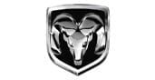 A silver rams head logo with curved horns inside a black and silver shield, representing the Dodge Ram vehicle brand.