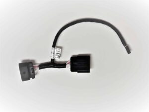 A black automotive wiring harness with connectors and a protective sleeve, featuring a white label with barcodes and numbers, displayed on a white background.